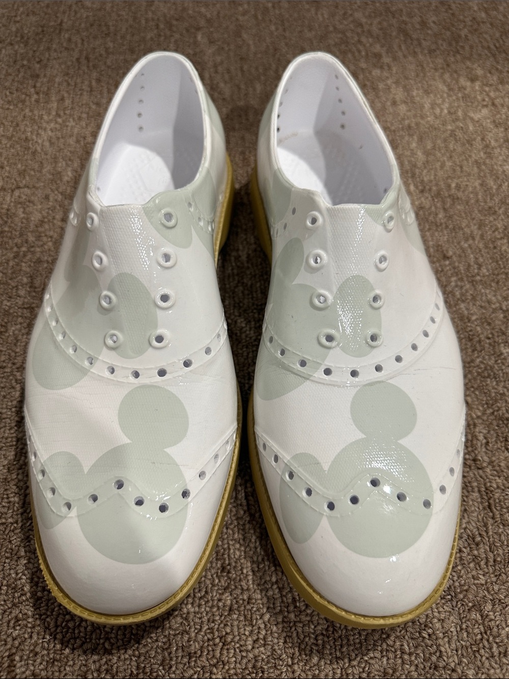 Women's White Slip-On Wingtip Sneakers with Pale Green Accents